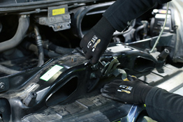 Working on a engine using the Connect Workshop Consumables Mechanics Cut Resistant Gloves (SKU 35374)